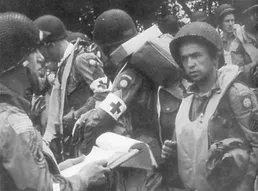 Photo of medics carrying gear